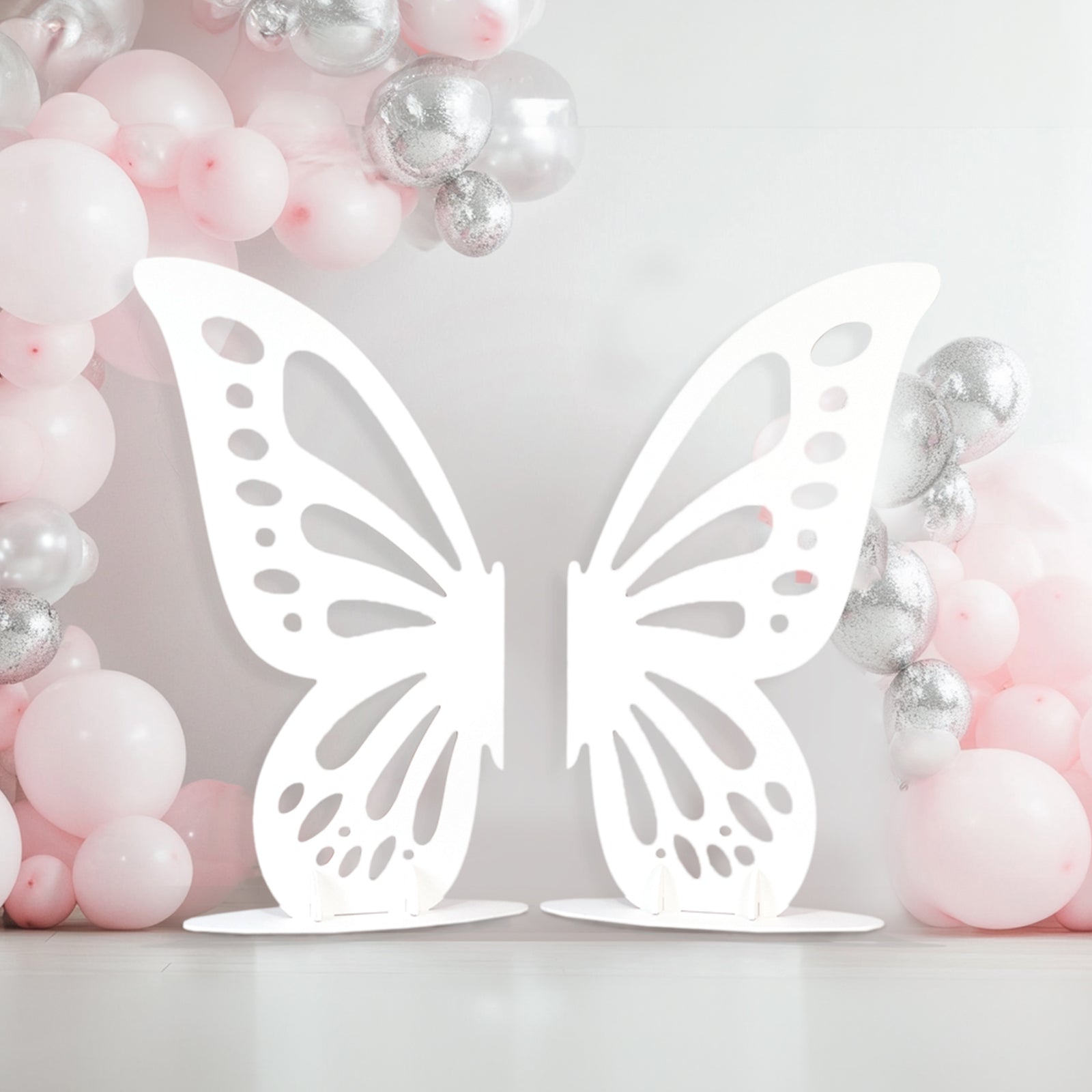 White freestanding wooden butterfly wings backdrop photo prop.
