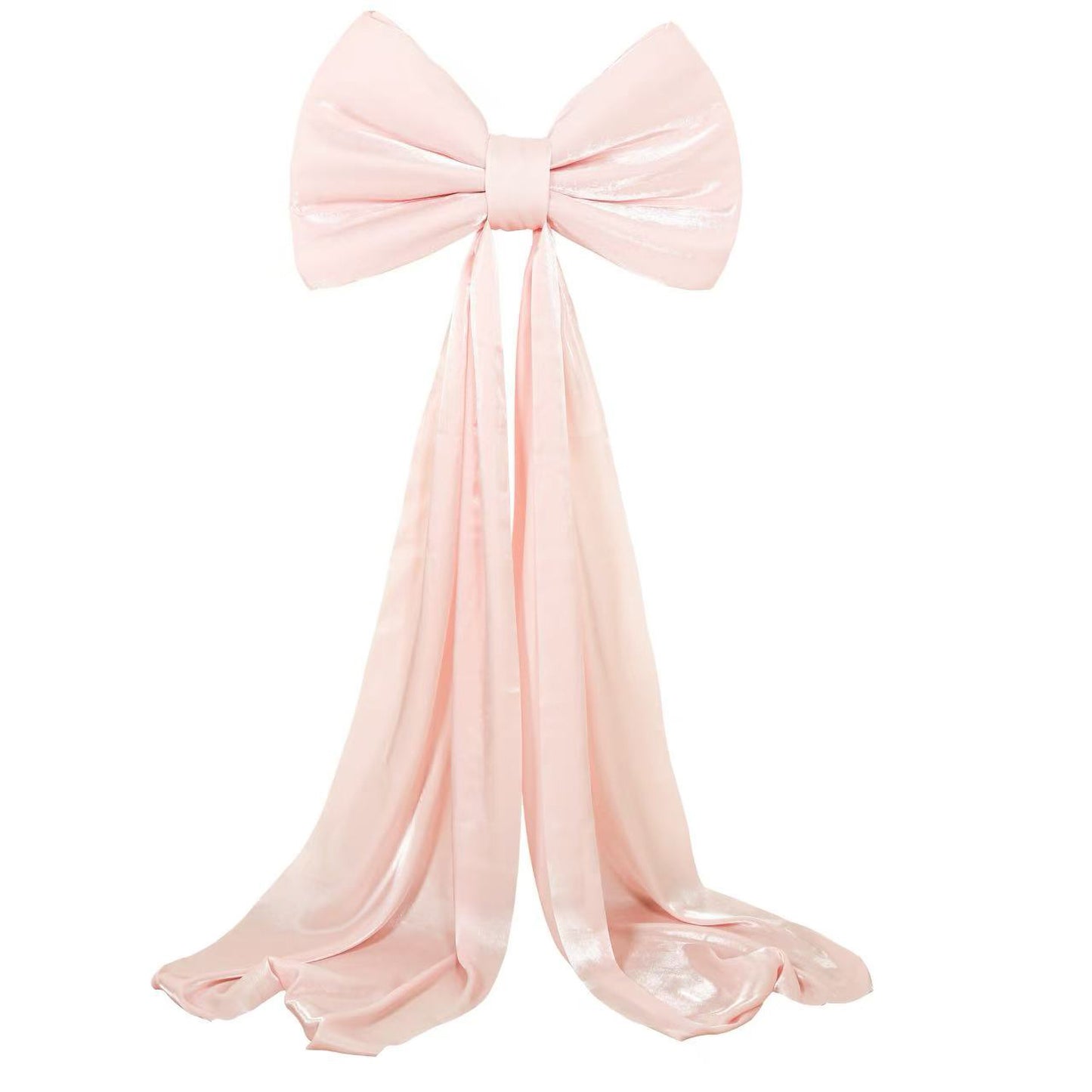 Blush pink giant bow tie décor for wedding and event backdrops.