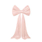 Blush pink giant bow tie décor for wedding and event backdrops.