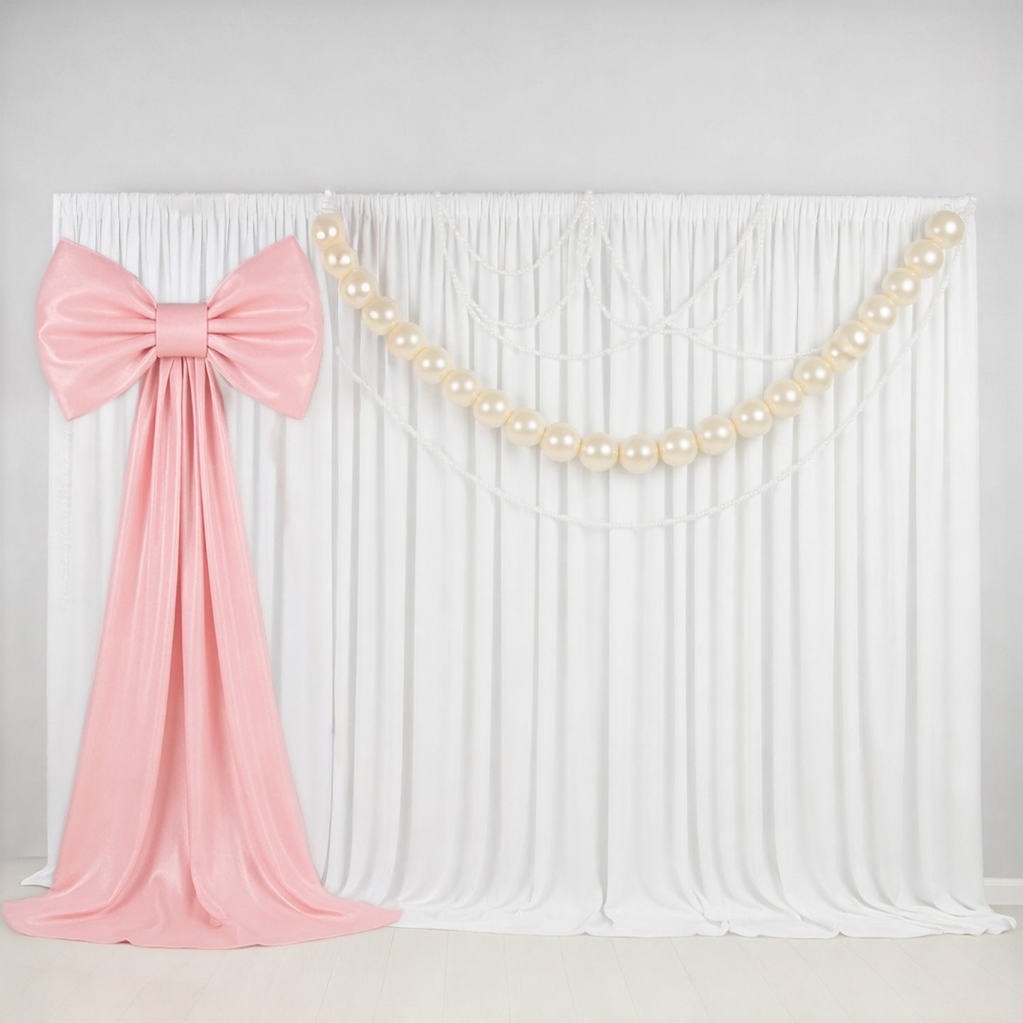 7ft giant blush pink bow tie décor for wedding and event backdrops.