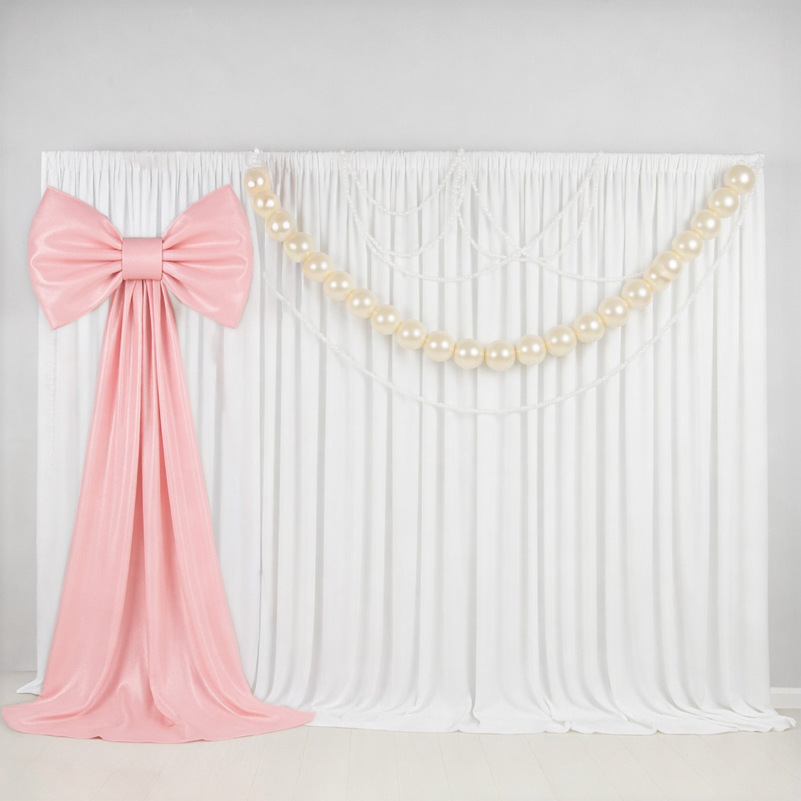 7ft giant blush pink bow tie décor for wedding and event backdrops.