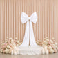 Giant white bow tie décor for wedding and event backdrops.
