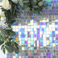 Iridescent blue sequin shimmer wall backdrop with floral accents.