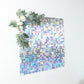 Iridescent blue sequin shimmer wall backdrop for party décor.