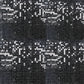 Shiny black sequin wall backdrop, perfect for party decor and photo settings.