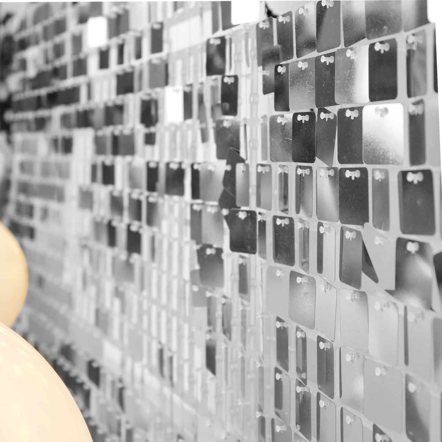 Shiny silver sequin shimmer wall backdrop for party décor.