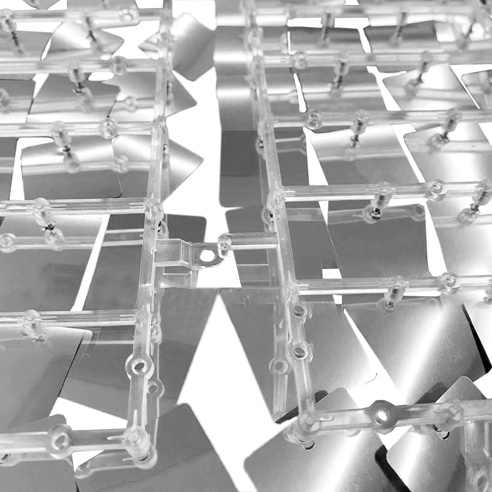 Shiny silver sequin wall backdrop panels for party decor.