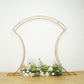 7ft gold double-curved metal arch frame with floral arrangement display.