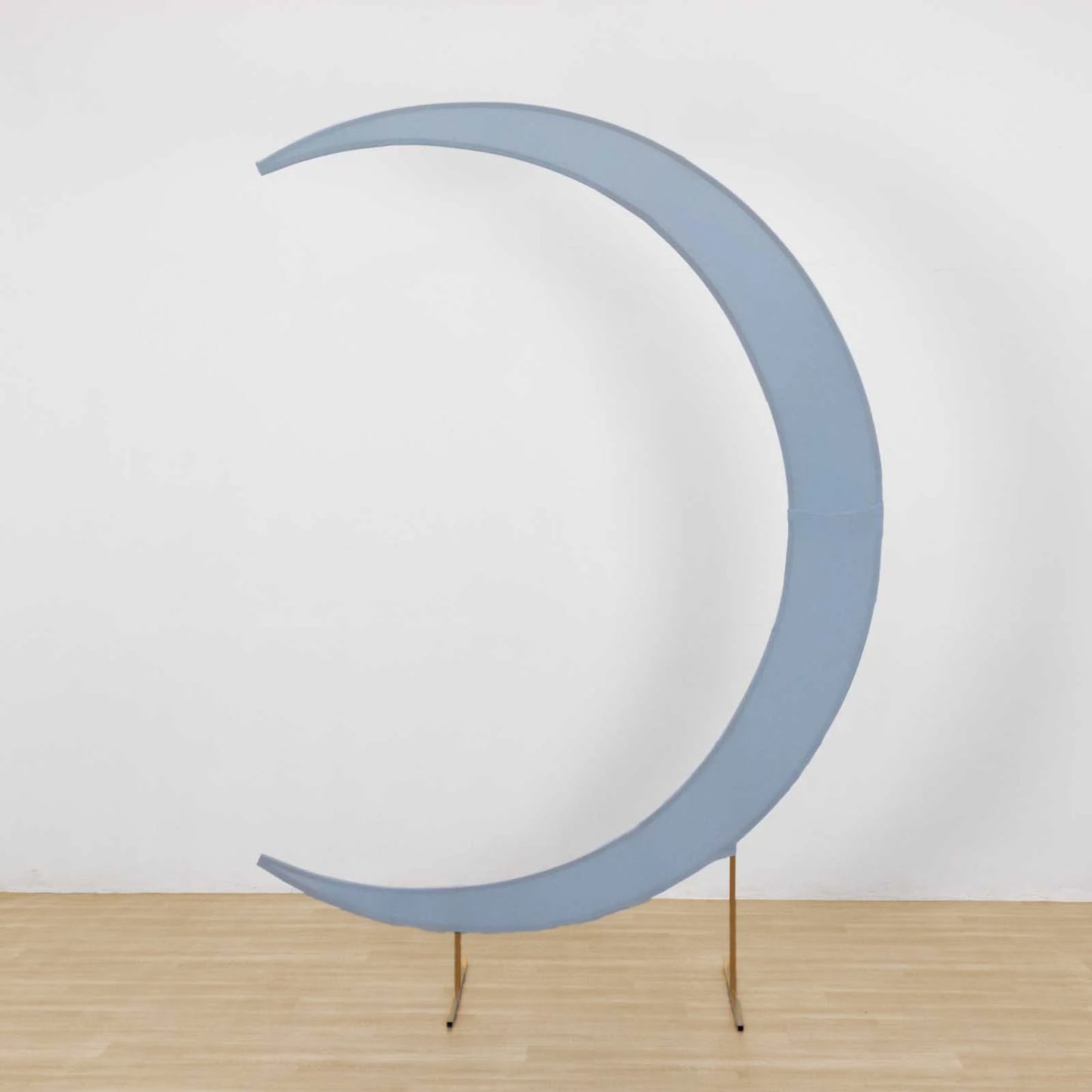 Dusty blue crescent moon wedding arch cover for backdrop.