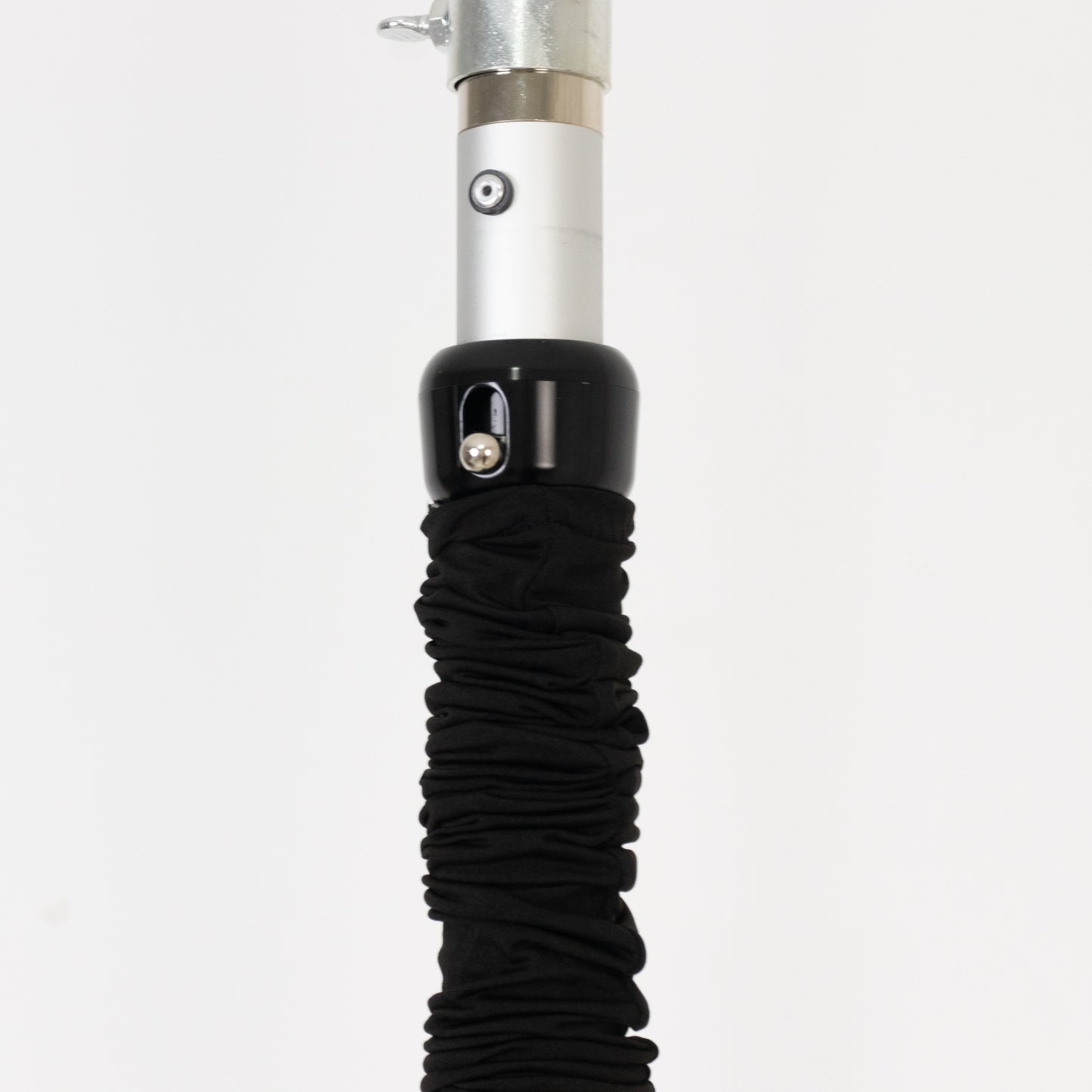 Black spandex pole cover for event setup and lighting use.