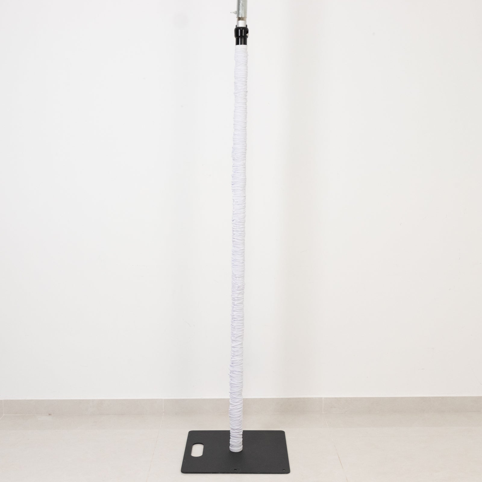 White spandex pole cover for event setups and lighting displays.