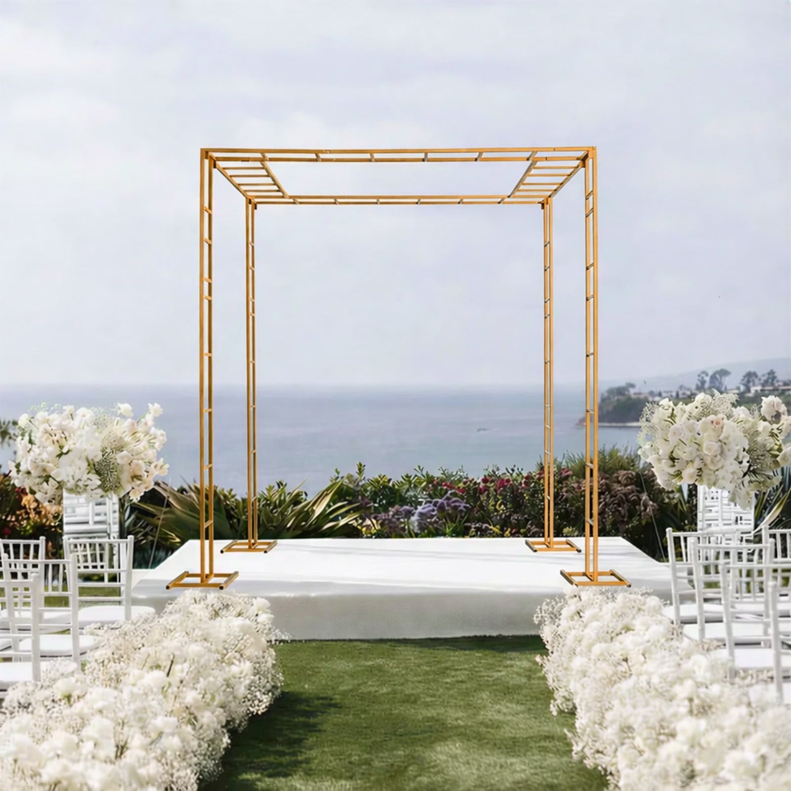 Gold metal event arch and canopy frame in an outdoor setting.