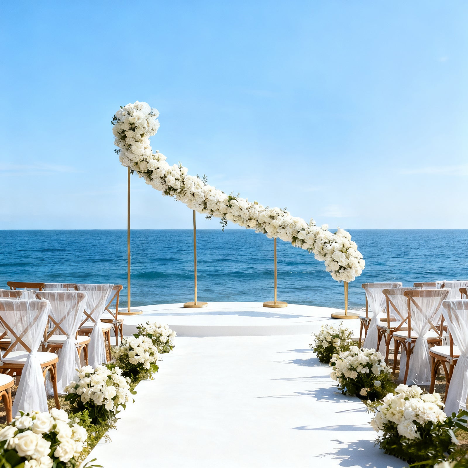 Gold curved wave wedding arch backdrop with floral decor by the ocean.