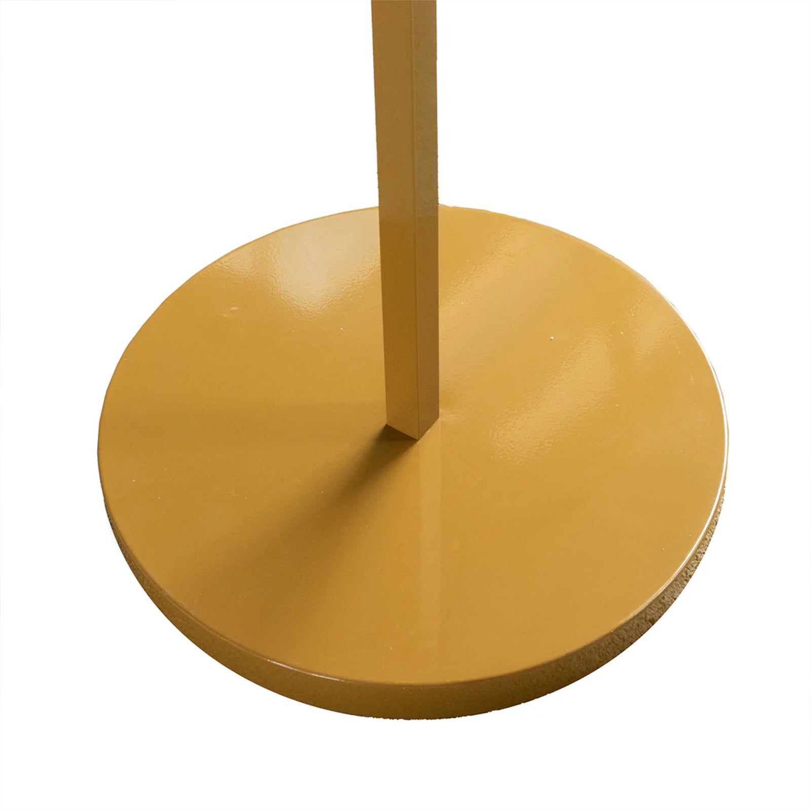 Gold round base of a heavy-duty wedding arch backdrop stand.