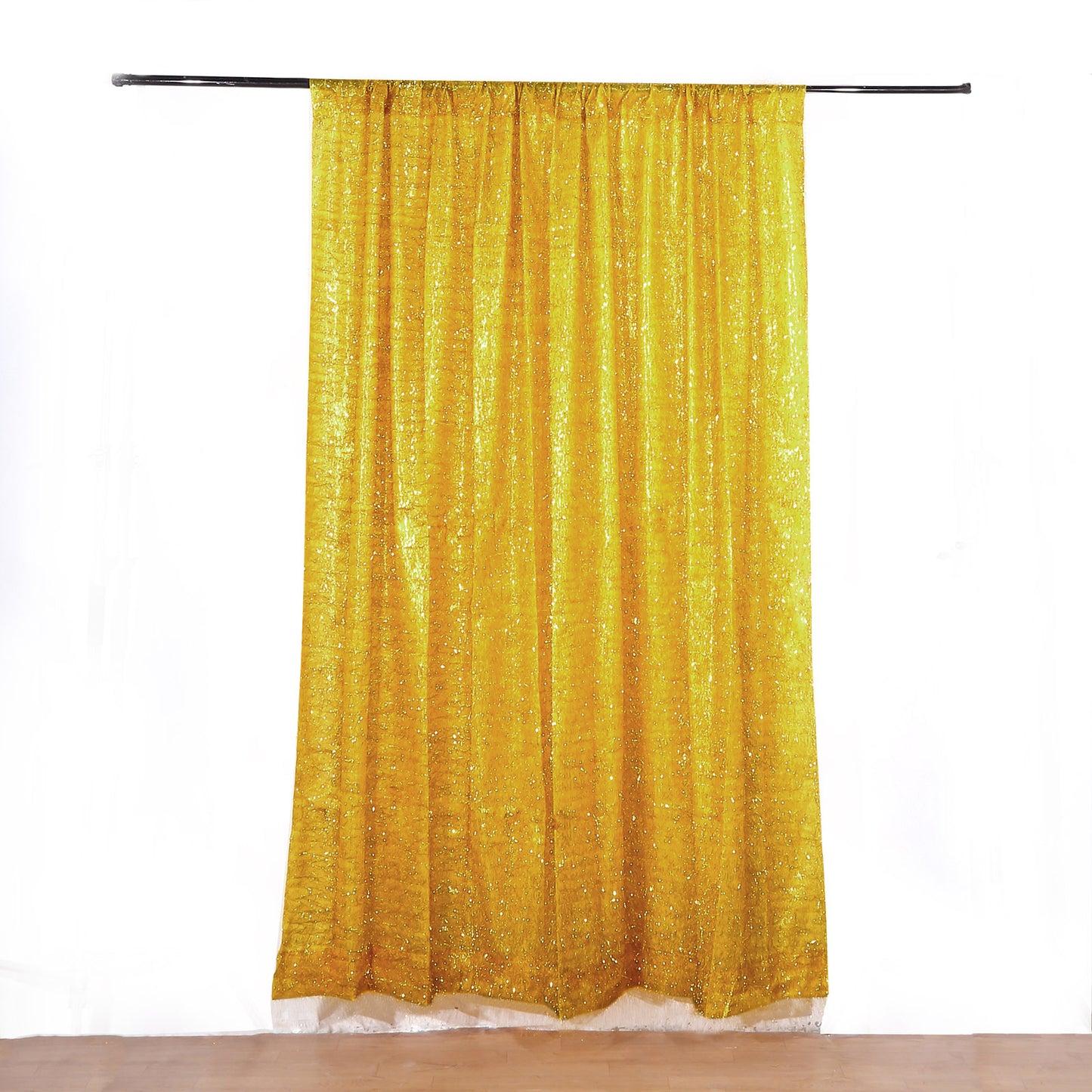 Gold metallic fringe drapery panel with shimmery tinsel finish.