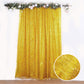 Gold metallic fringe drapery panel with shimmery tinsel effect.