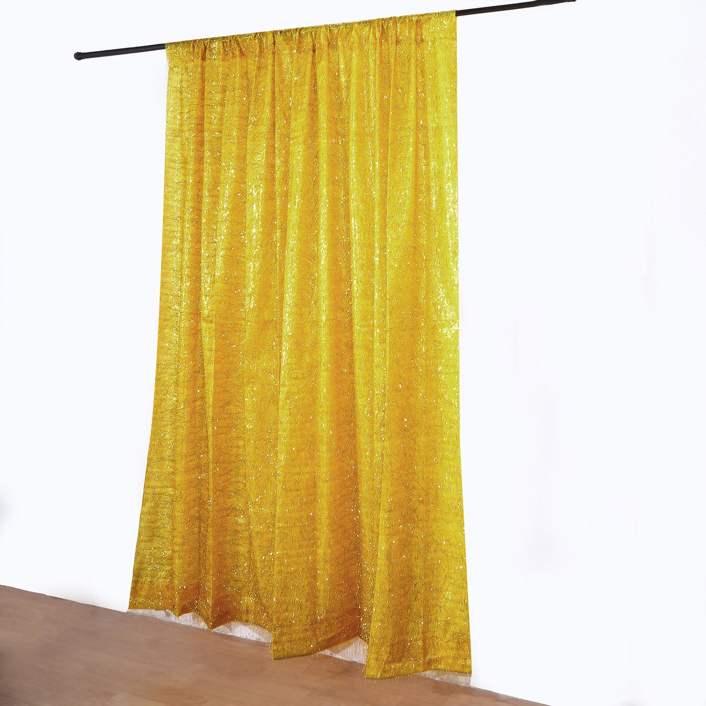 Gold metallic fringe drapery panel curtain for events.
