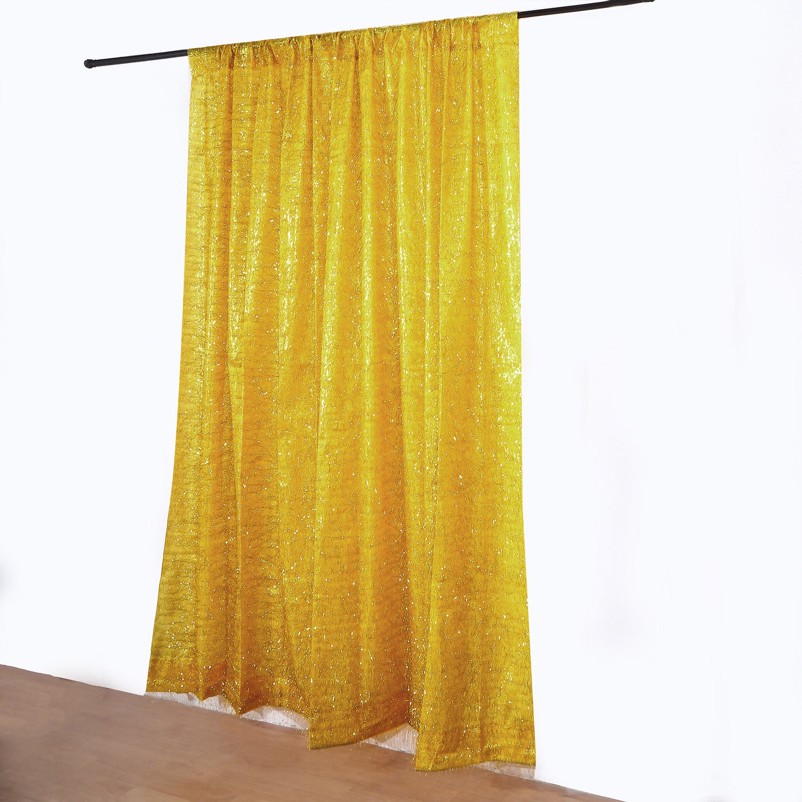 Gold metallic fringe drapery panel curtain for events.