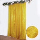 Gold metallic fringe drapery panel backdrop curtain with shimmery tinsel.