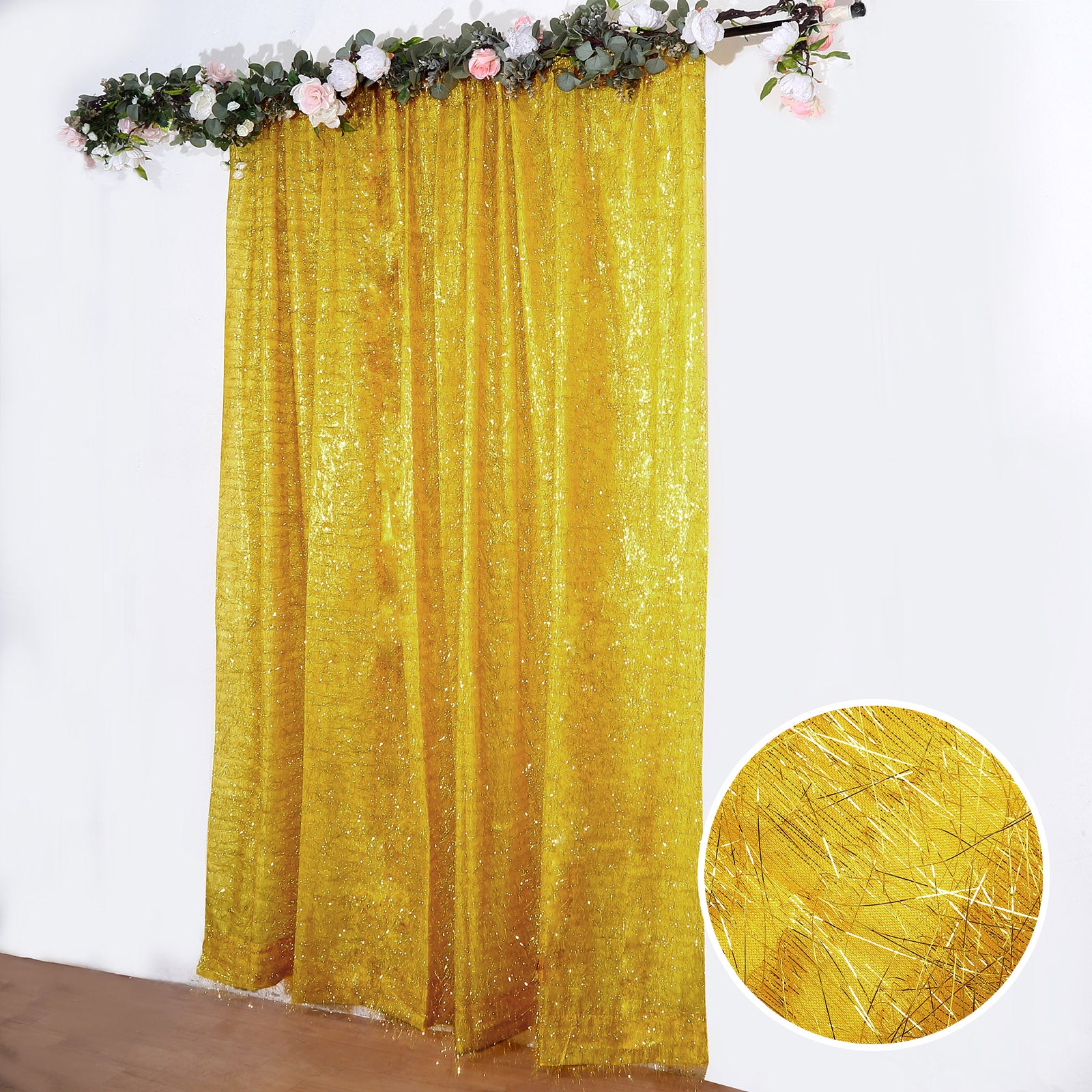 Gold metallic fringe drapery panel backdrop curtain with shimmery tinsel.