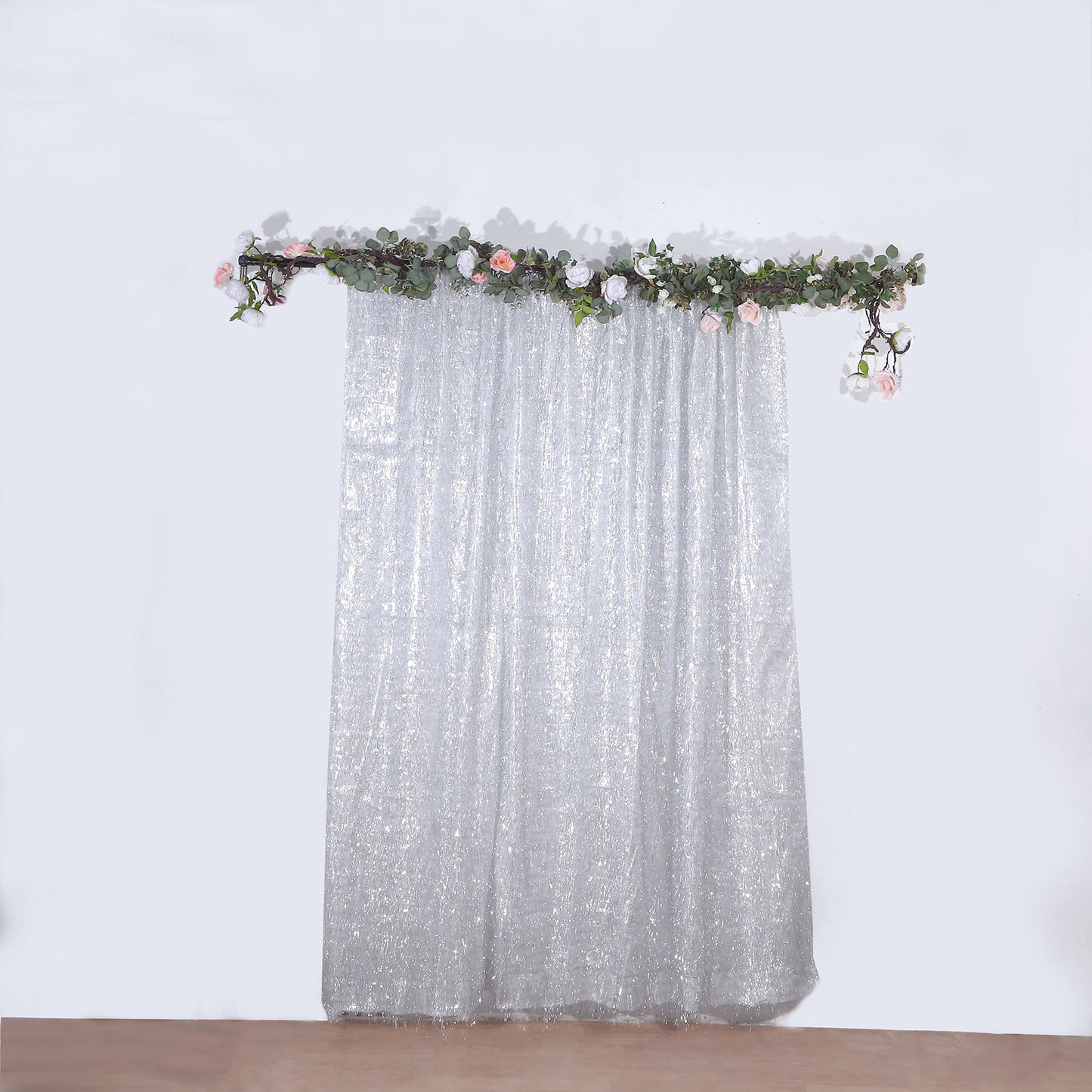 8ft silver metallic fringe shag backdrop curtain with floral decoration.