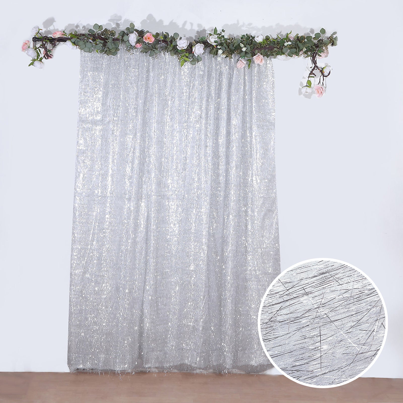 Silver metallic fringe shag curtain backdrop panel.
