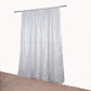 Silver metallic fringe backdrop curtain panel for events.