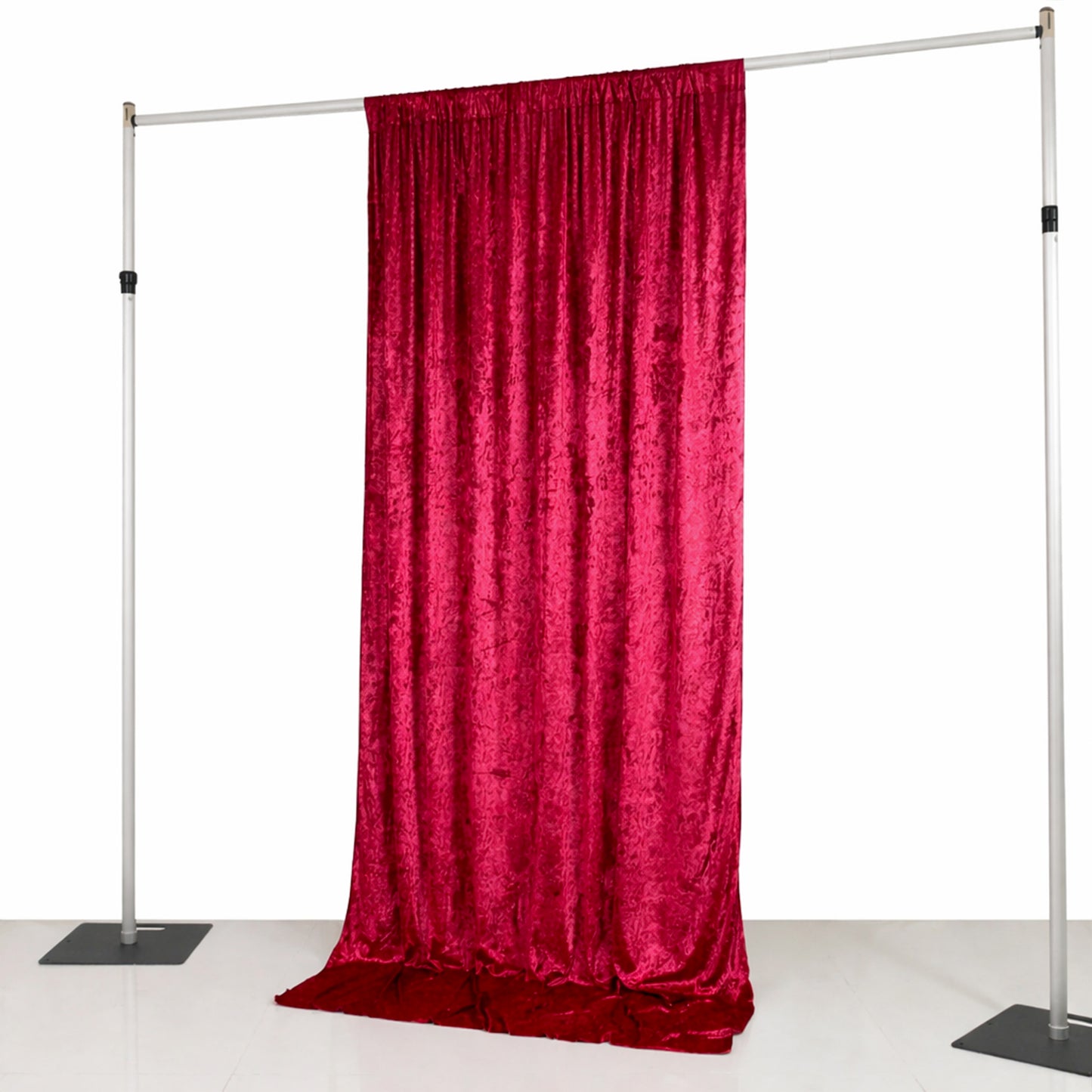 Red crushed velvet backdrop curtain for events and photo booths.