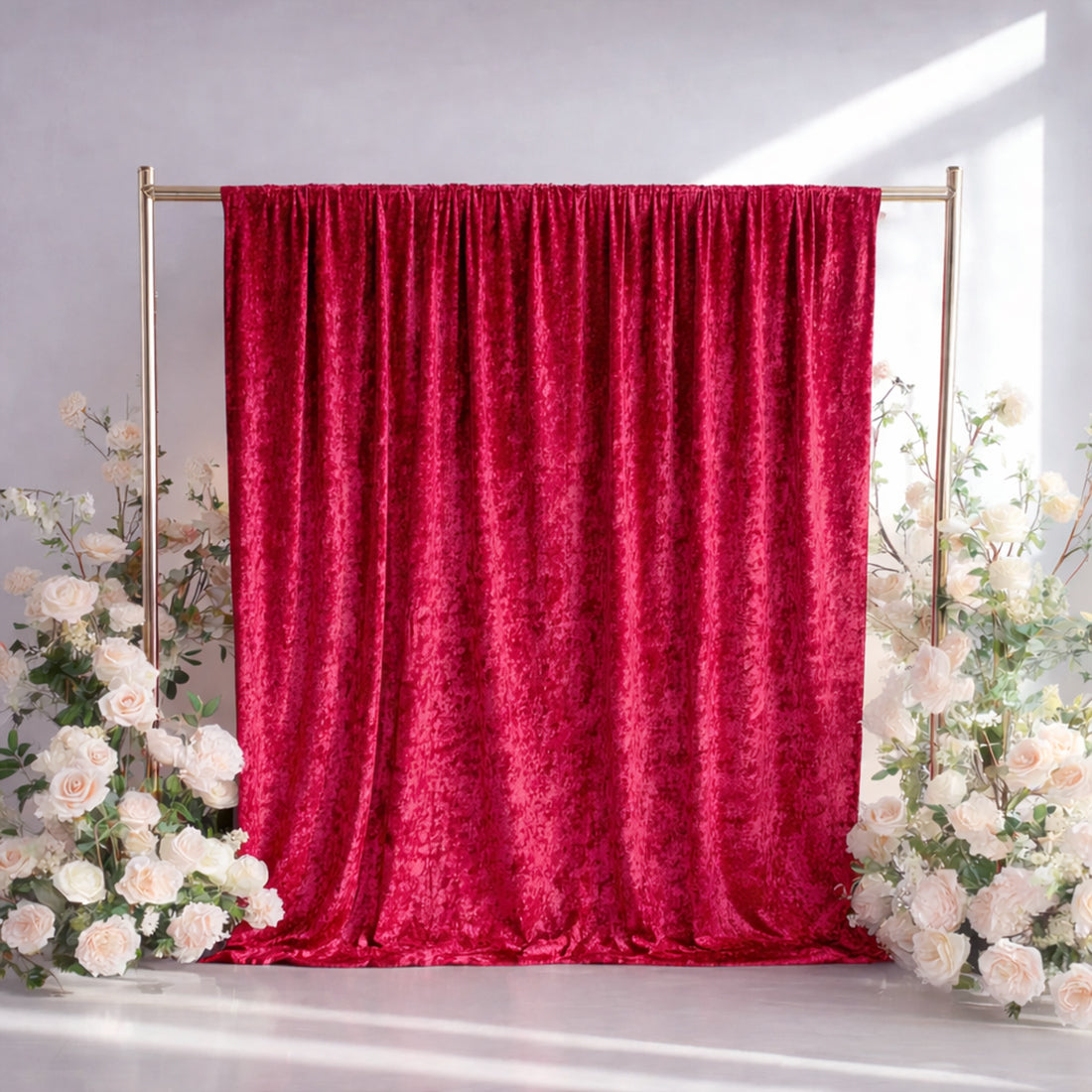 Red crushed velvet backdrop curtain for events and photo booths.