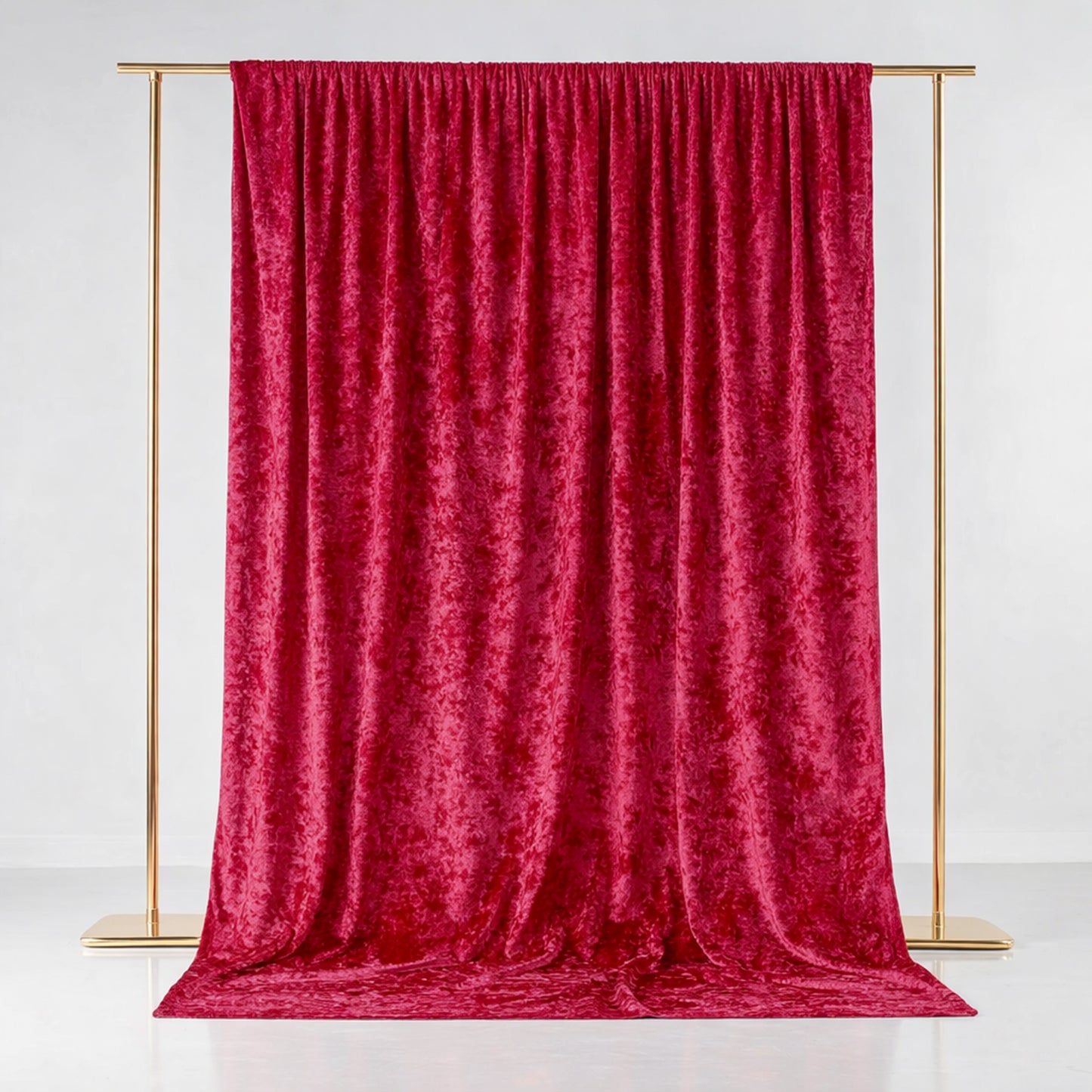 Red crushed velvet backdrop curtain for events and photo booths.