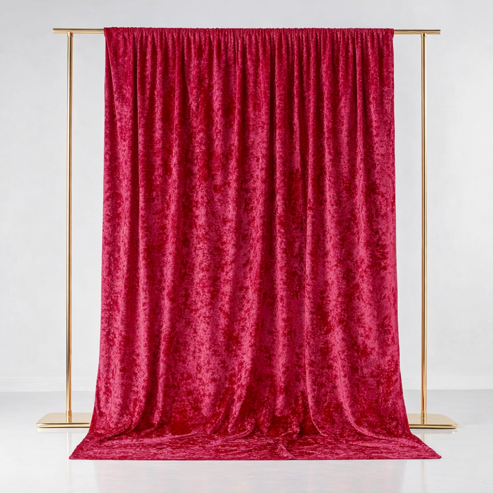 Red crushed velvet backdrop curtain for events and photo booths.