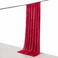 Red crushed velvet backdrop curtain for events and photo booths.