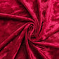 Red crushed velvet backdrop for events and photo booths.