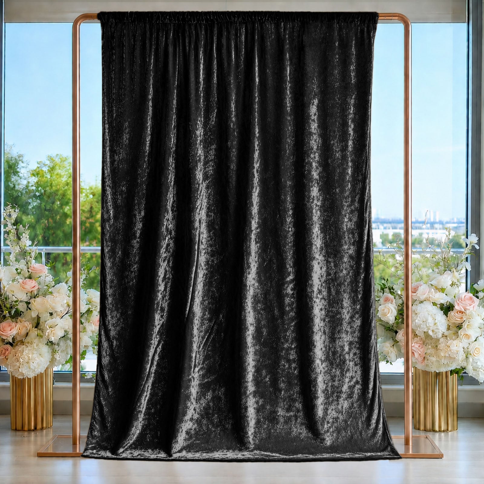 Black crushed velvet backdrop curtain for events and photo booths.