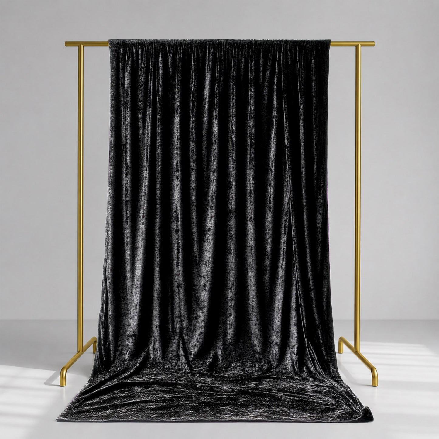 Black crushed velvet backdrop curtain for events and photo booths.