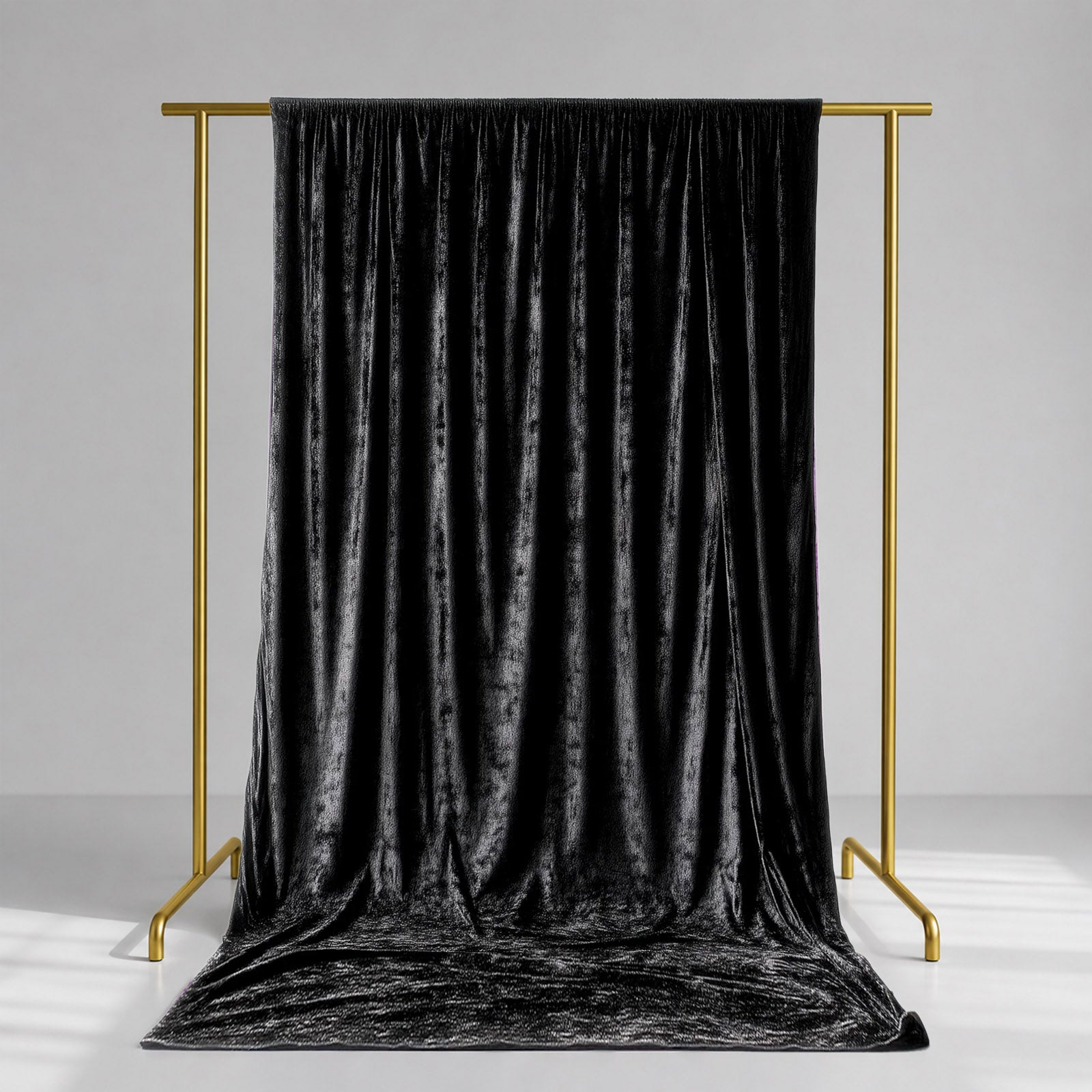 Black crushed velvet backdrop curtain for events and photo booths.