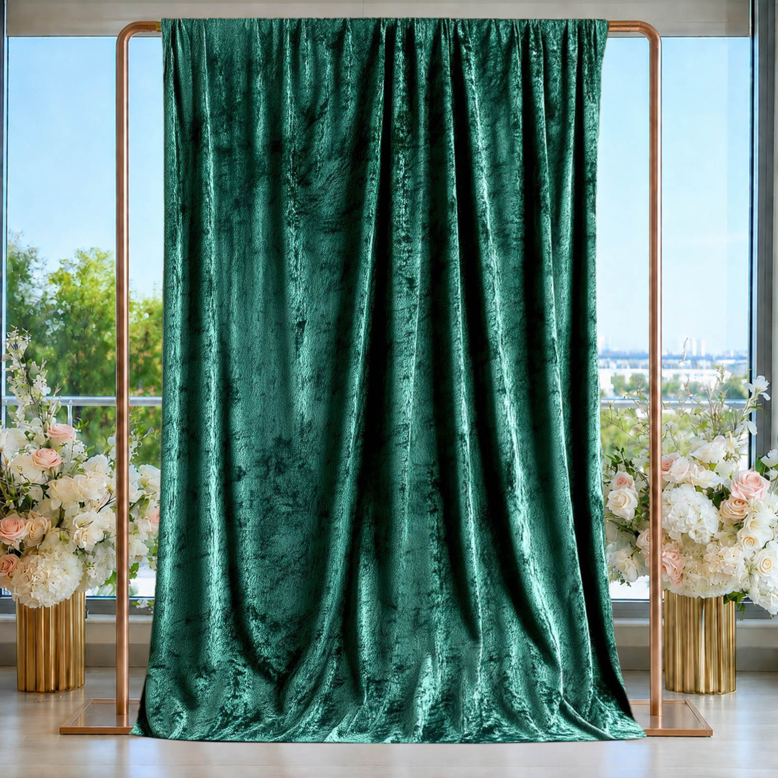 Emerald green crushed velvet backdrop curtain for events and photo booths.