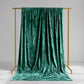 Emerald green crushed velvet backdrop curtain for events and photo booths.