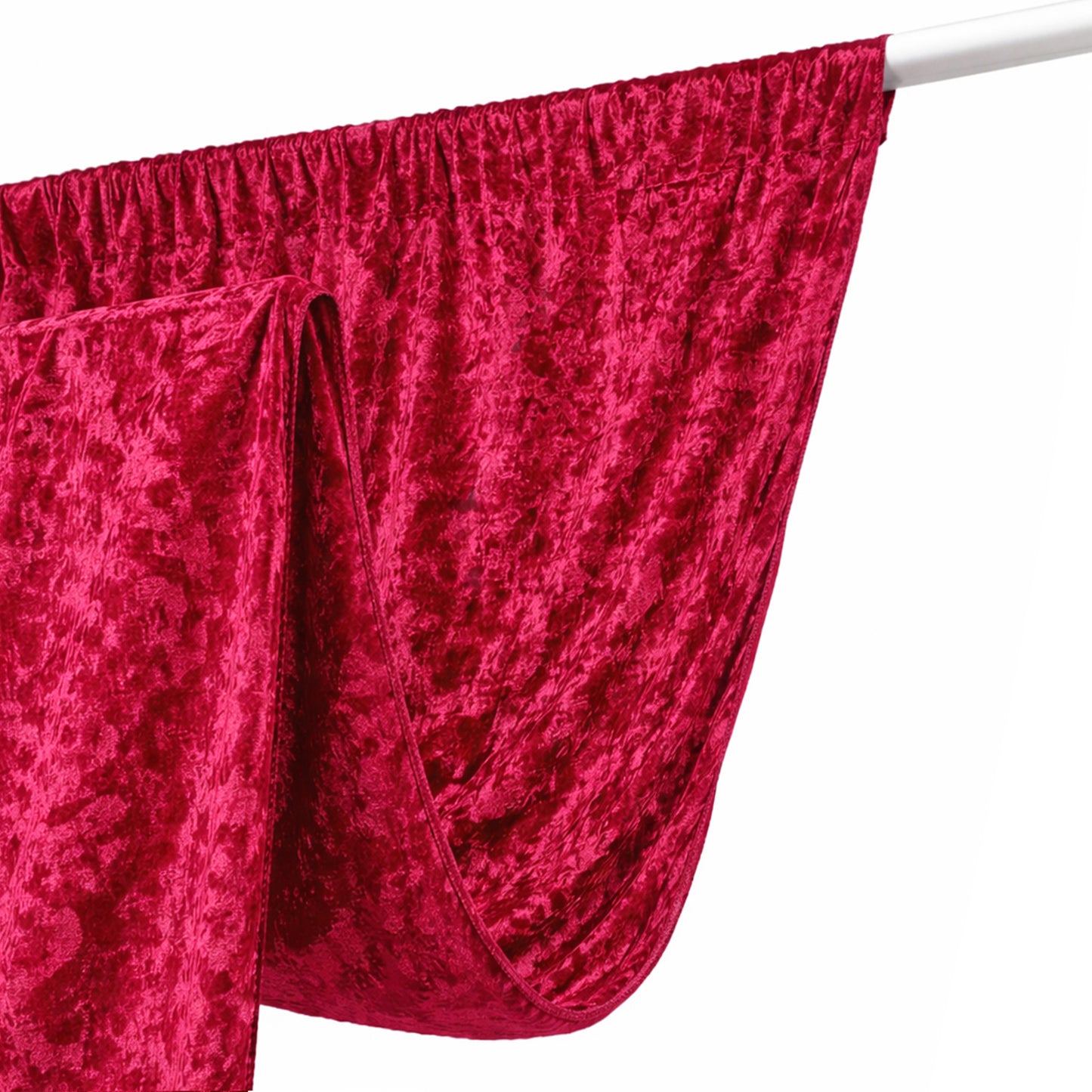 Rich red velvet fabric draped elegantly on a white rod.