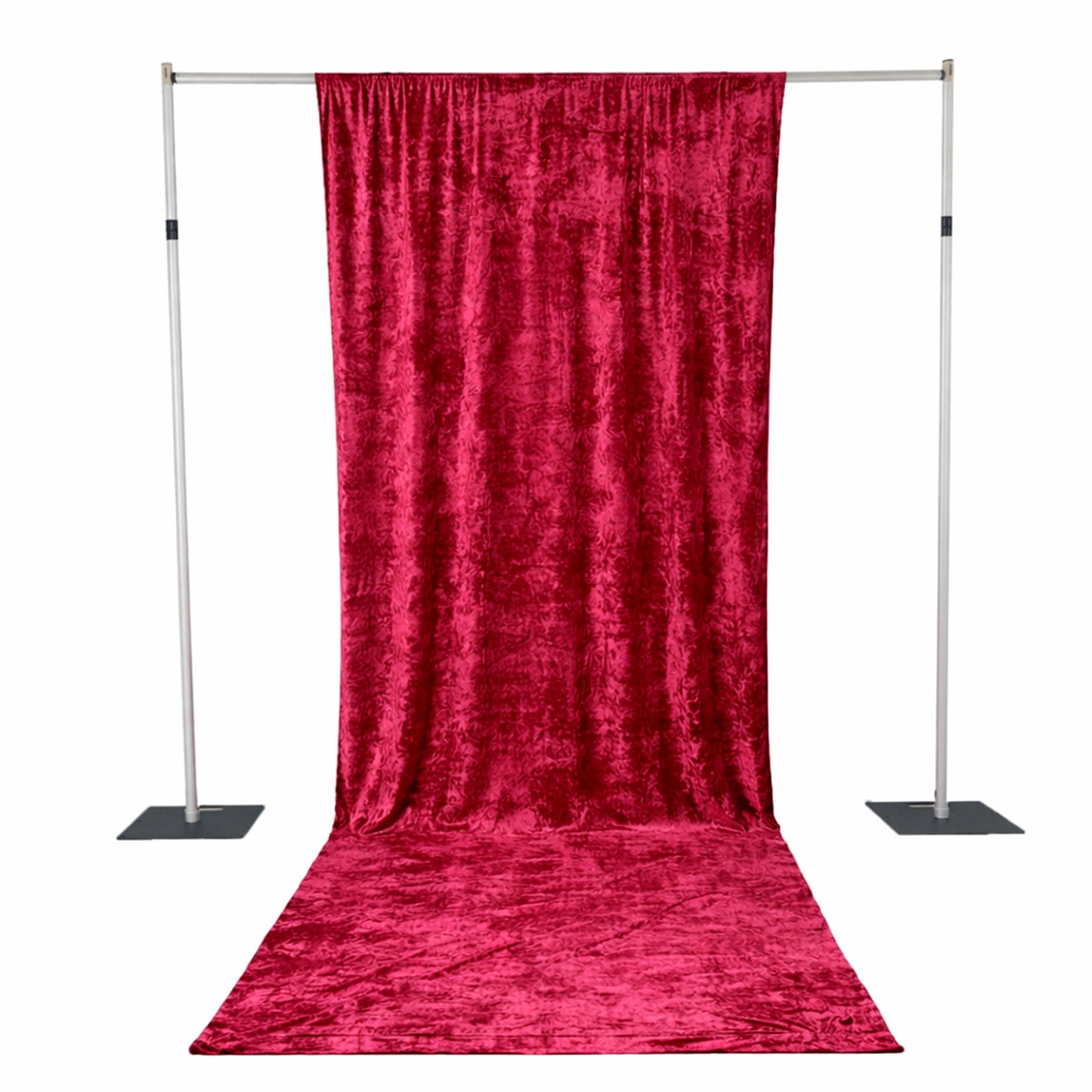 Red velvet backdrop for photo shoots on adjustable stand.