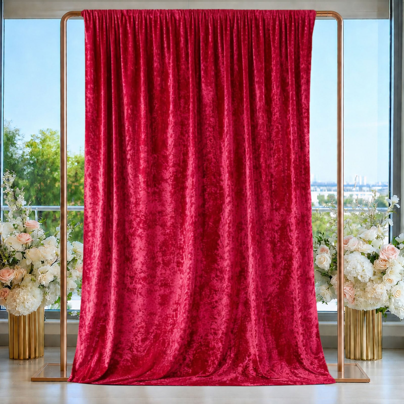 Red crushed velvet backdrop curtain for events and photo booths.