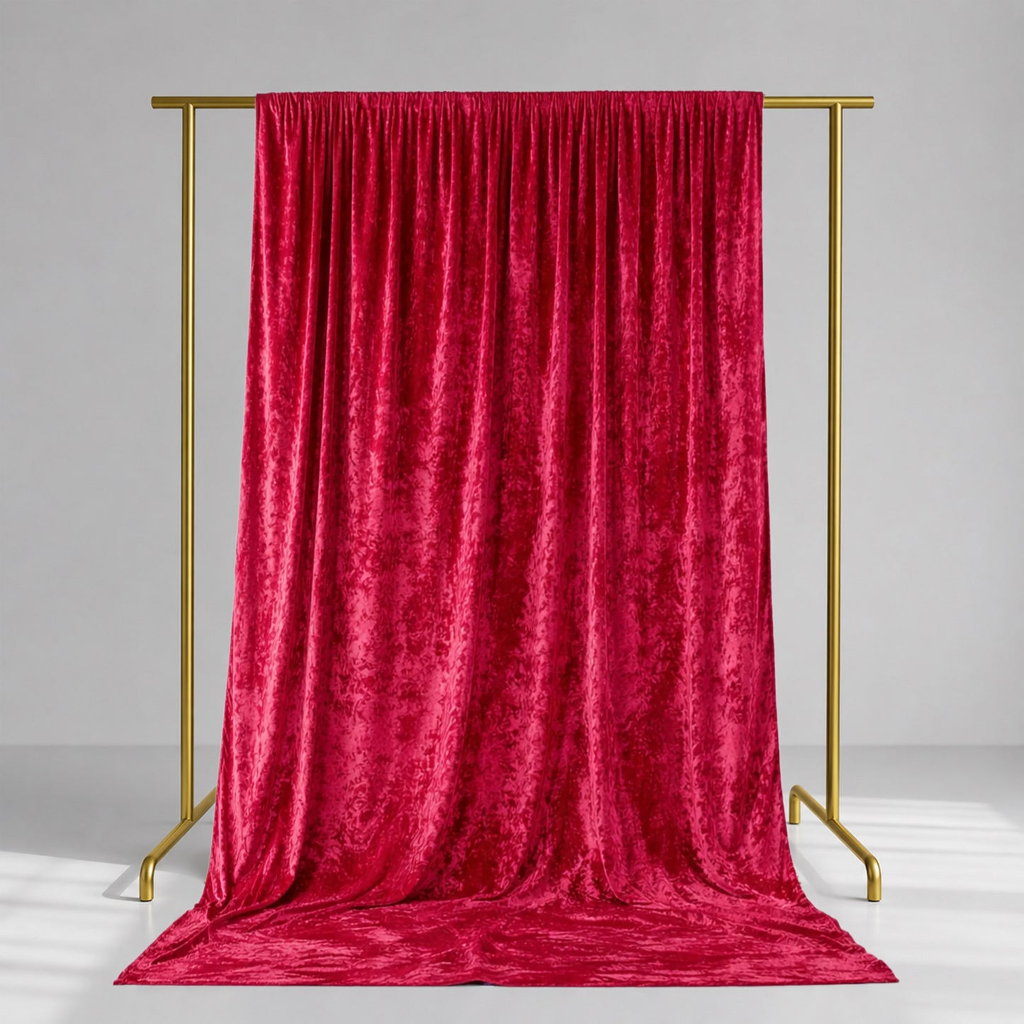 Red crushed velvet backdrop curtain for events and photo booths.