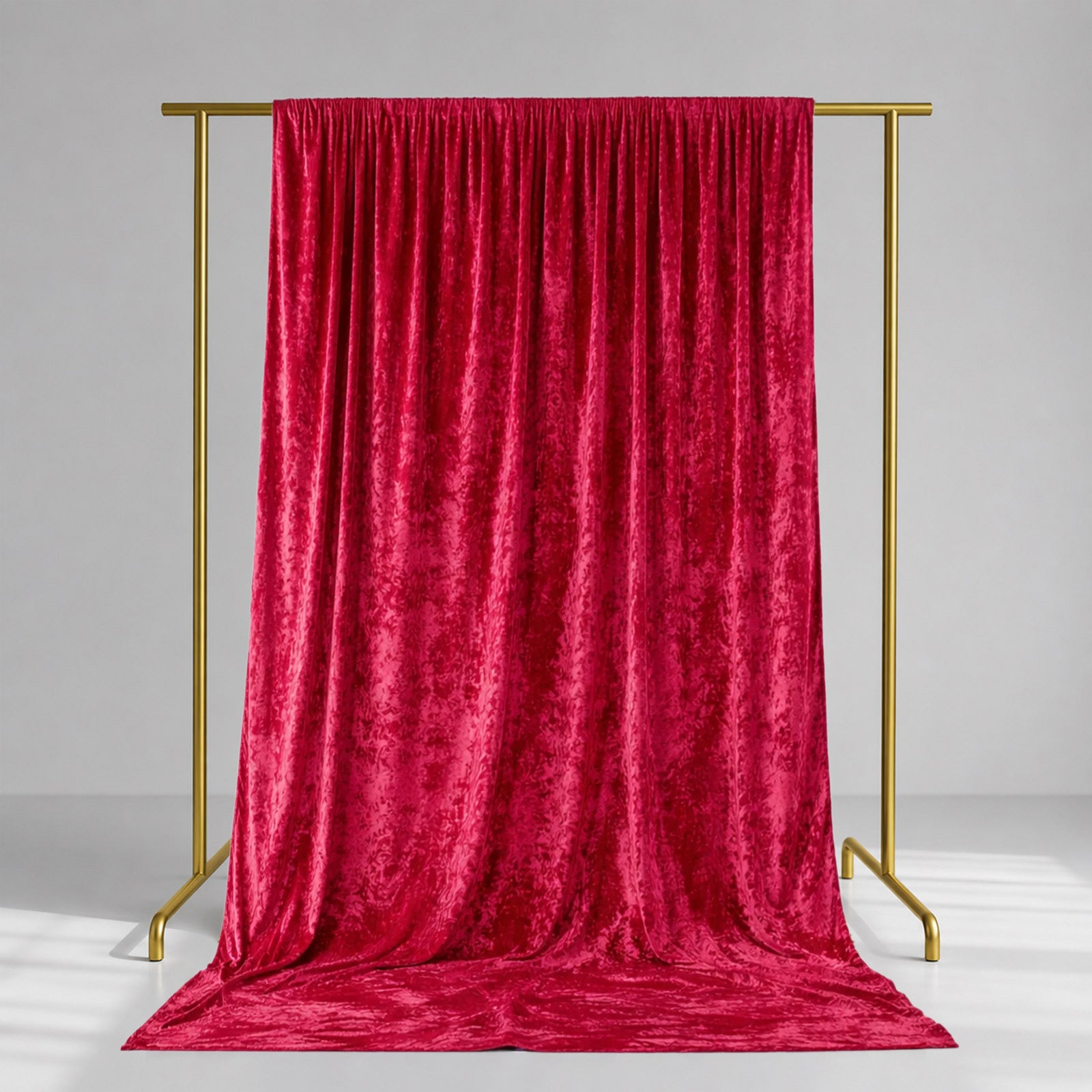 Red crushed velvet backdrop curtain for events and photo booths.