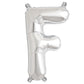 Shiny metallic silver letter balloon "F" in a party decoration setting.