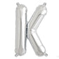 Shiny metallic silver letter balloon 'K' for celebrations.