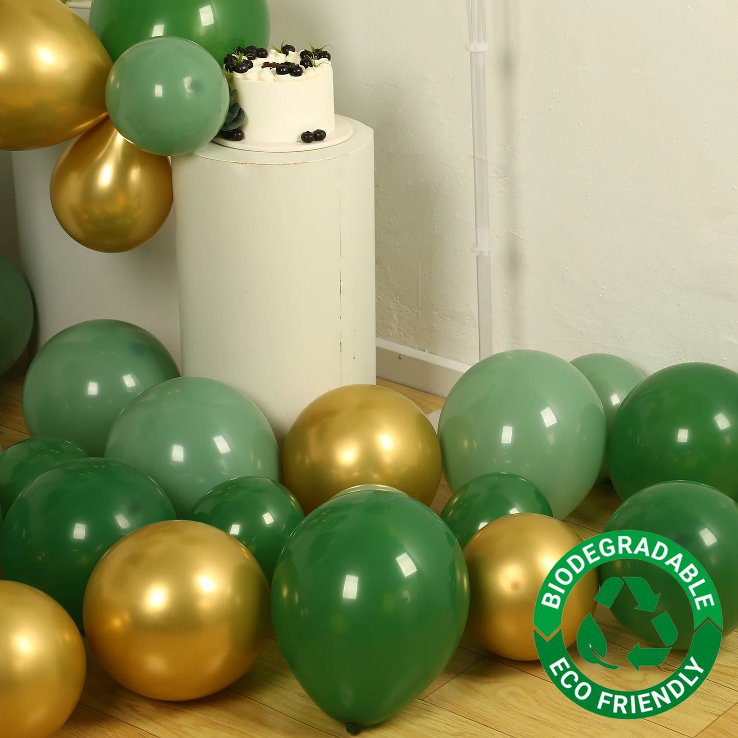 Gold and green biodegradable balloon arch kit for eco-friendly celebrations.