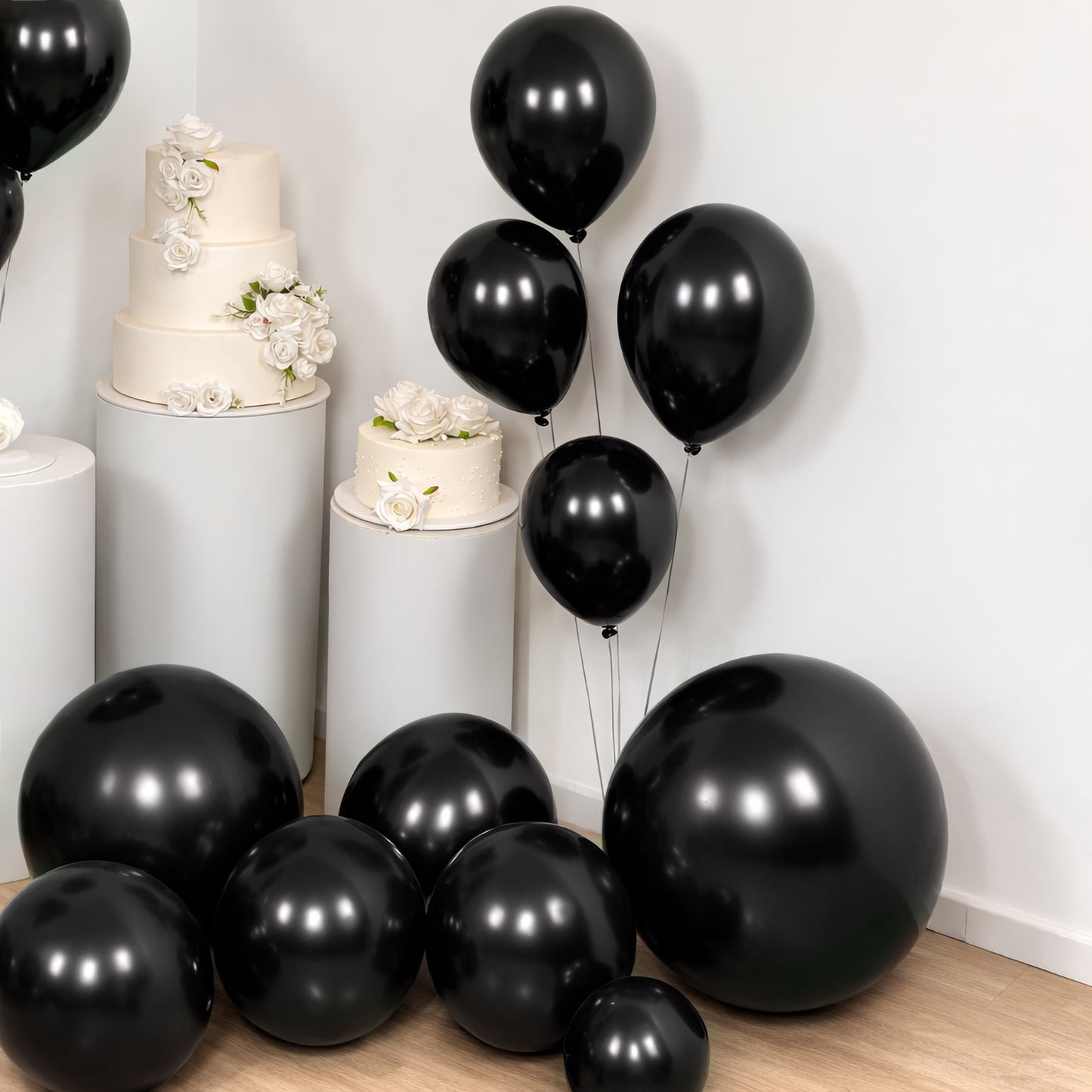 Black balloon garland kit for party arch décor, featuring biodegradable latex balloons.