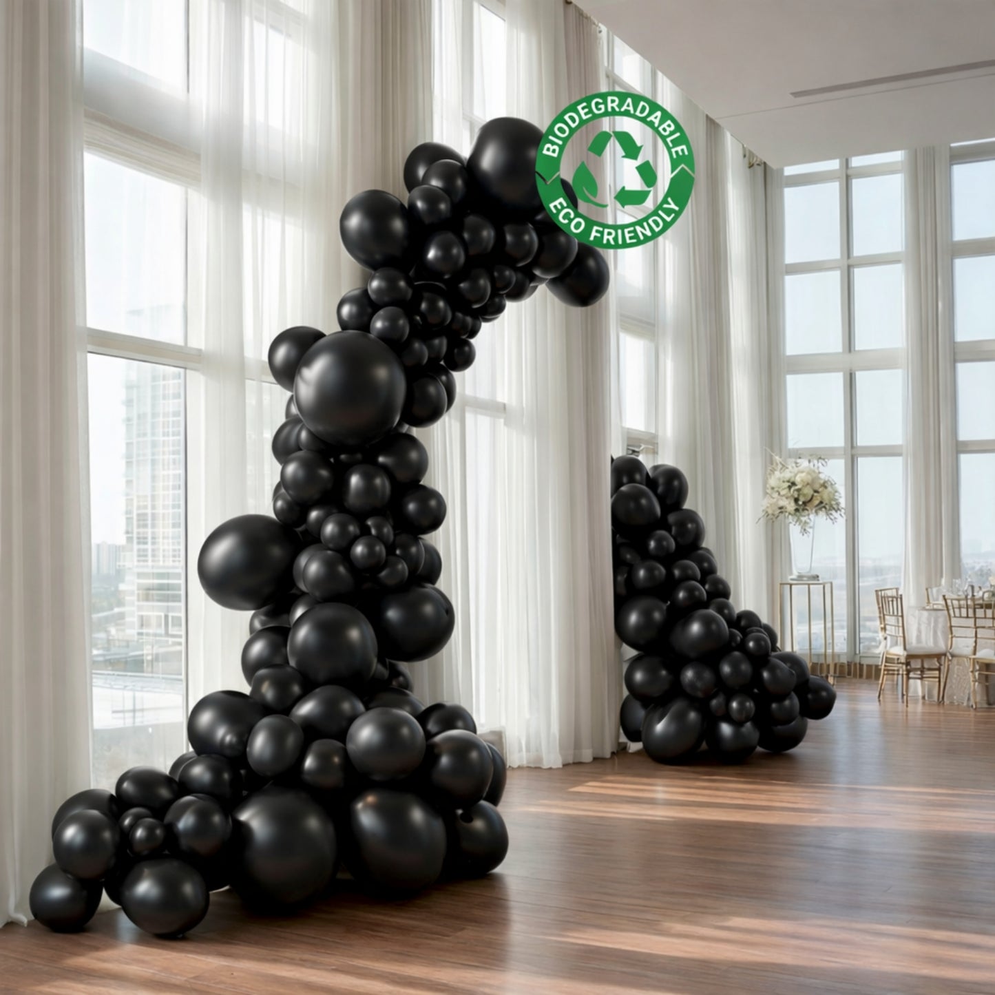 Black balloon garland arch for party décor, eco-friendly and biodegradable.