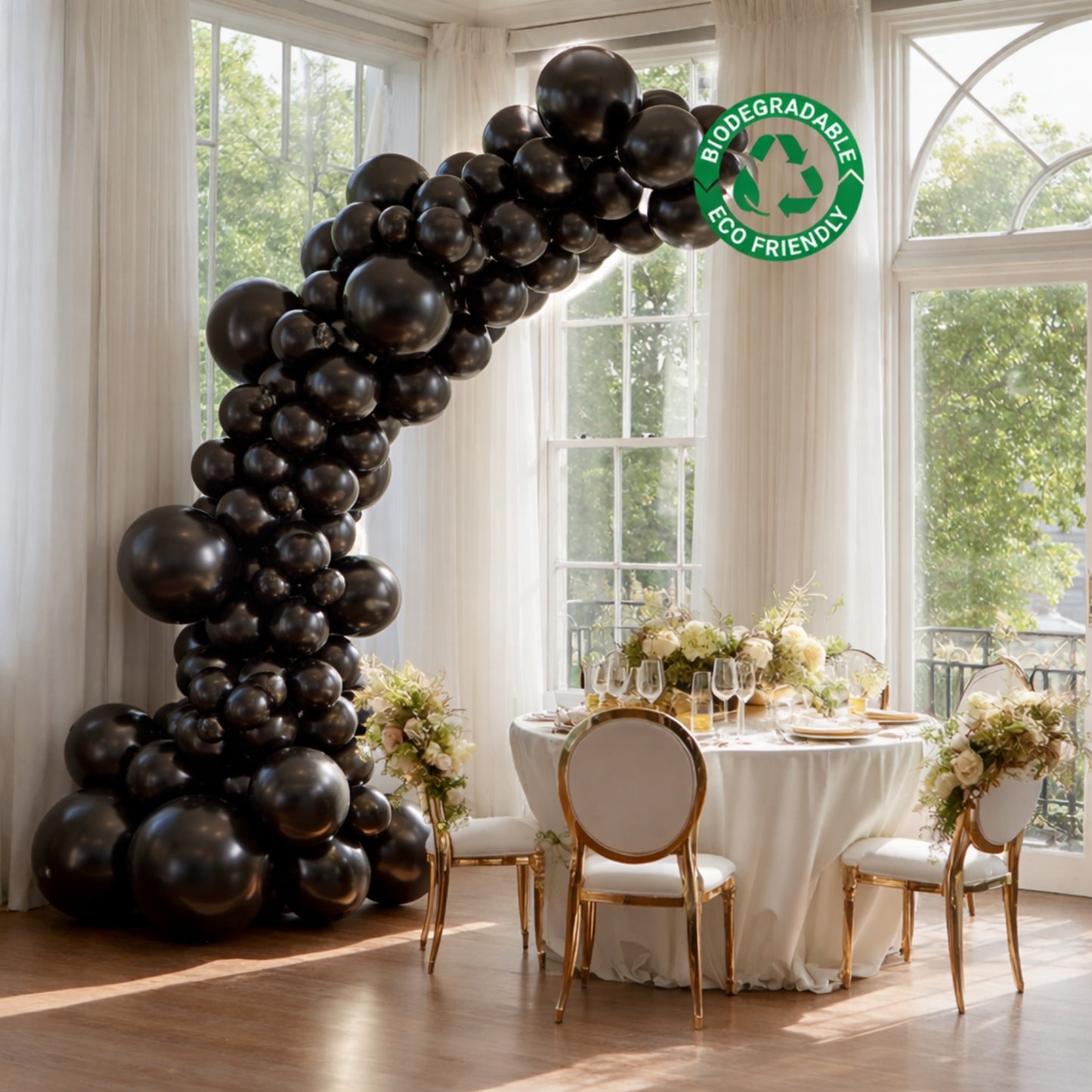 Black balloon garland arch for party décor, featuring biodegradable latex balloons.