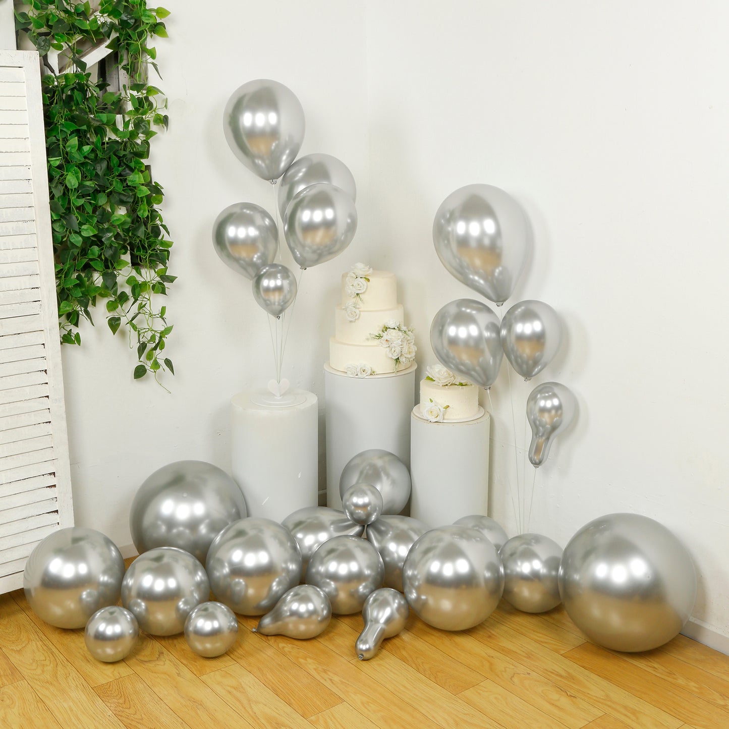 Silver balloon garland kit for party arch décor, featuring biodegradable latex balloons.
